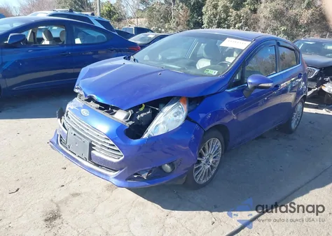 2014 Ford Fiesta Titanium z USA, uszkodzony, nr VIN 3FADP4FJ3EM176698